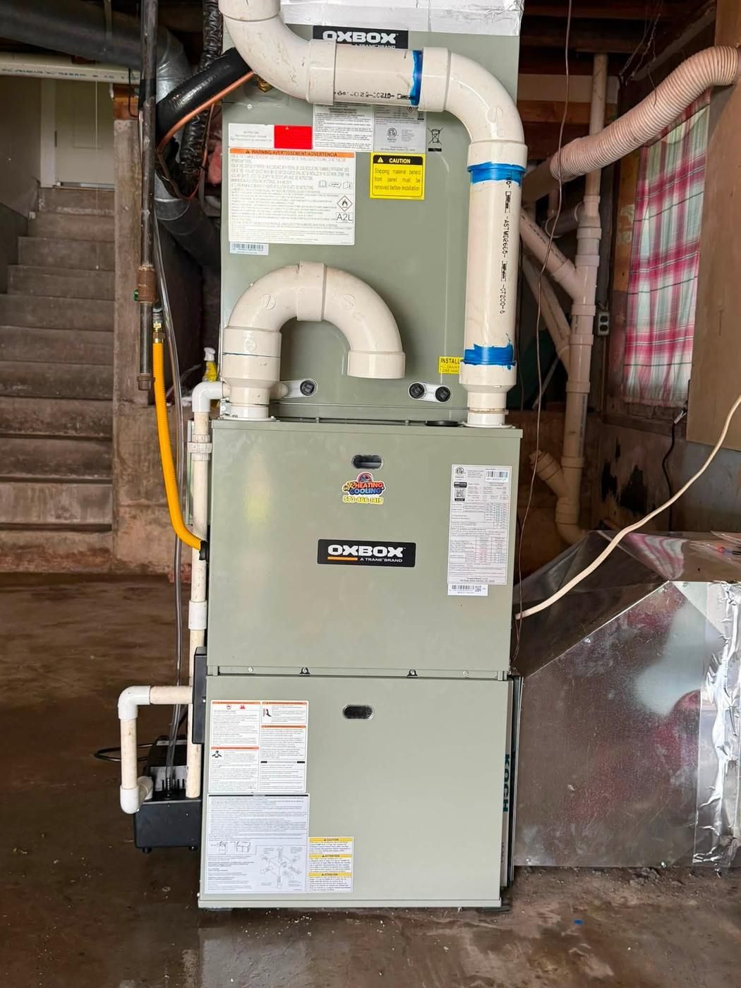 Oxbox gas furnace installed in a basement with the condensate pump plumbed in
