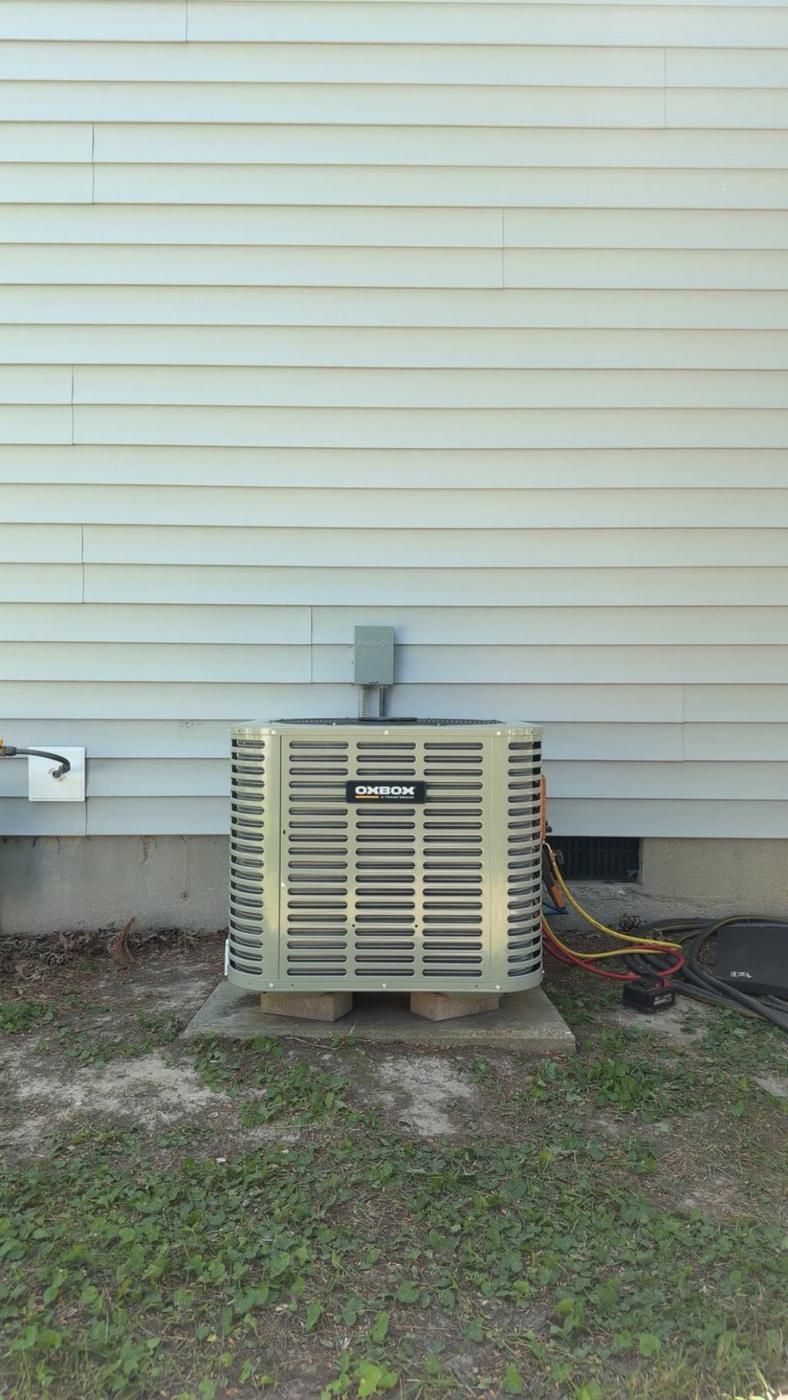 Oxbox condenser on blocks mid-job, with the gauges still hooked up