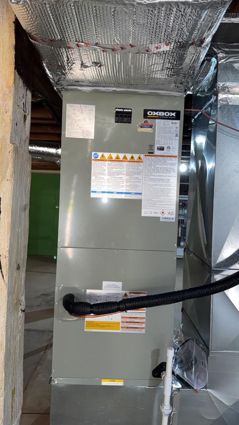 Oxbox air handler tied into insulated ductwork in a basement